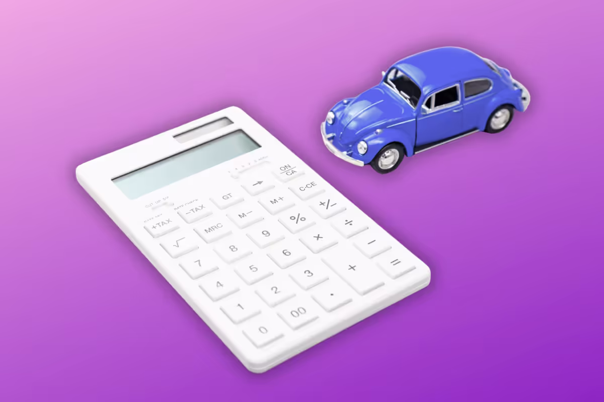 An image of a purple toy car, its model is a VW Beetle and a claculator laying side by sdie on a purple ombre background. 