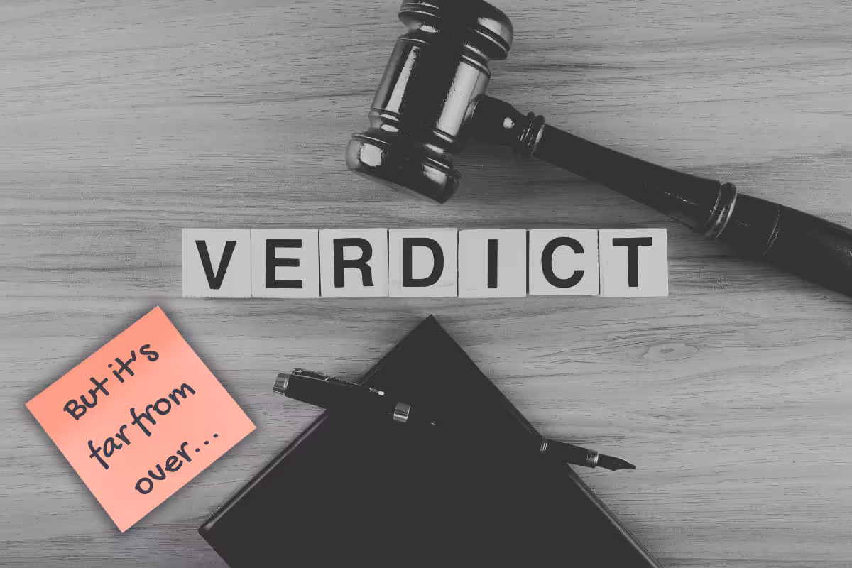 An image of a gavel with a lettered tiles spelling out Verdict. There's also a closed book, pen and a post-it notes stating 'But it's far from over...'